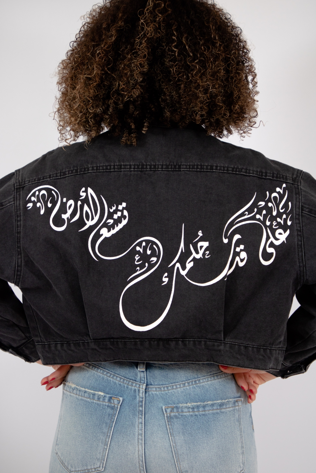 Exclusive denim jacket in black wash with hand-painted Arabic Calligraphy